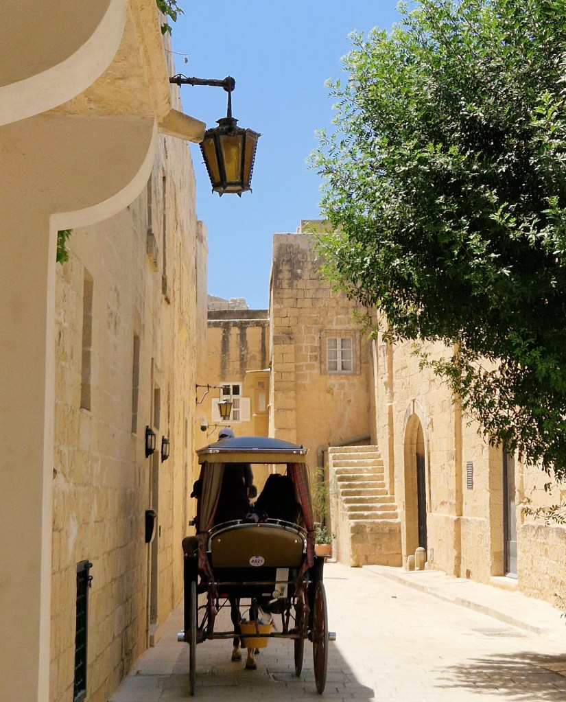 A horse-drawn carriage in a street in Mdina, Malta.