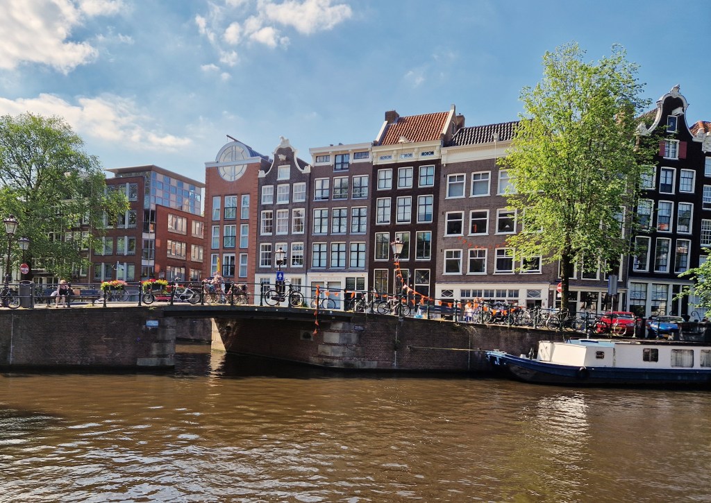 Typical Dutch houses in Amsterdam overlooking a canal