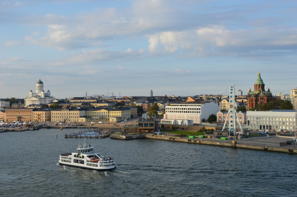Skyline of Helsinki from a cruise: Helsinki cathedral, Uspenski cathedral and the Ferris Wheel.